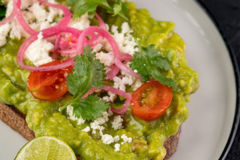 Gourmet Avocado Toast with toppings for brunch at Kilo Seminyak