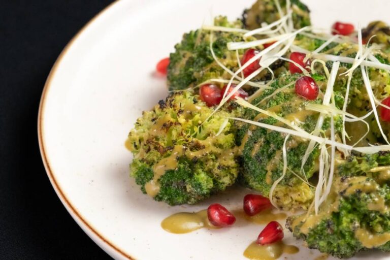 Grilled Broccoli with Pomegranate healthy vegetable dish at Kilo Seminyak