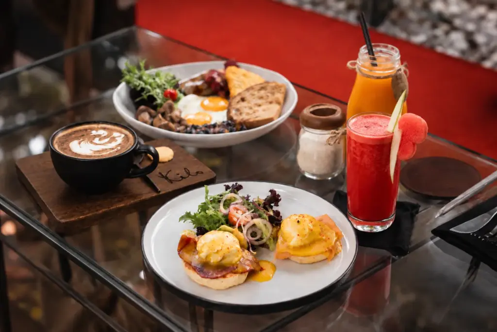 Kilo's breakfast package featuring savory dishes, fresh juice, and coffee in Seminyak