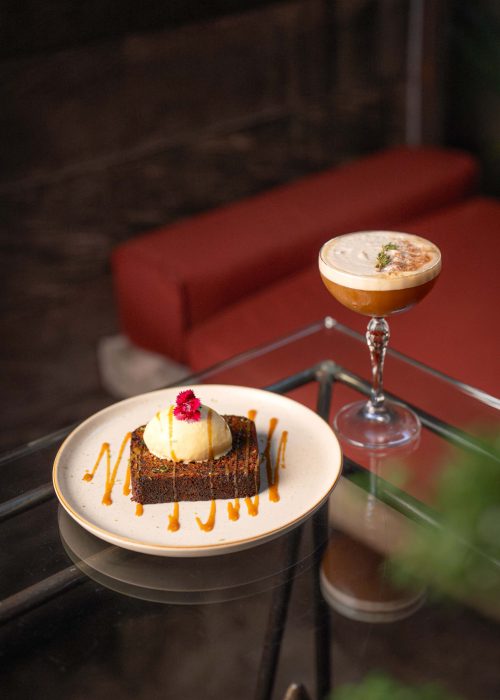 A plated dessert paired with a signature cocktail at Kilo Kitchen Bali.