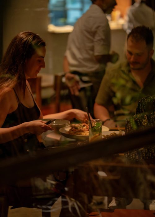 Guests dining indoors at Kilo Kitchen Bali, best dining in Seminyak