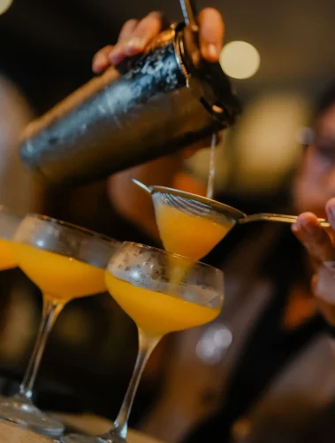 Screwzudriver cocktail being poured at Kilo Kitchen Bali, Due Course Providore Series
