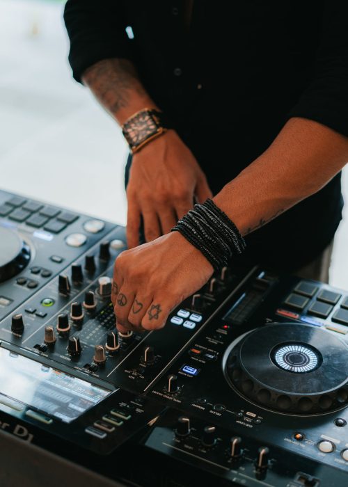 DJ adjusting music controls during an event